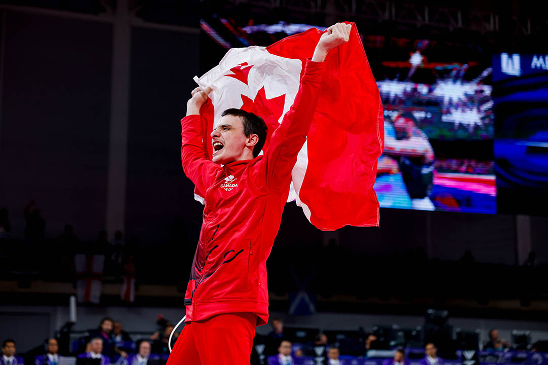 University of Saskatchewan engineering student Jordan Carroll displays the gold medal he won on pommel horse at the Commonwealth Games. (Photo: Antoine Saito/Gymnastics Canada)