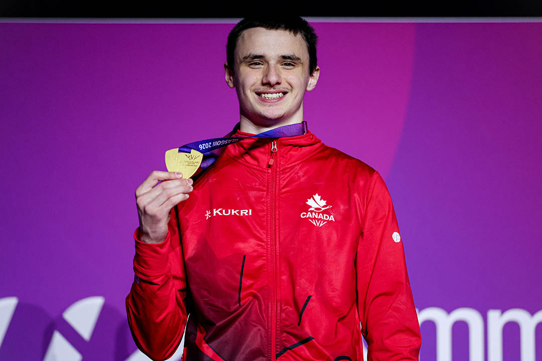 University of Saskatchewan engineering student Jordan Carroll displays the gold medal he won on pommel horse at the Commonwealth Games. (Photo: Antoine Saito/Gymnastics Canada)
