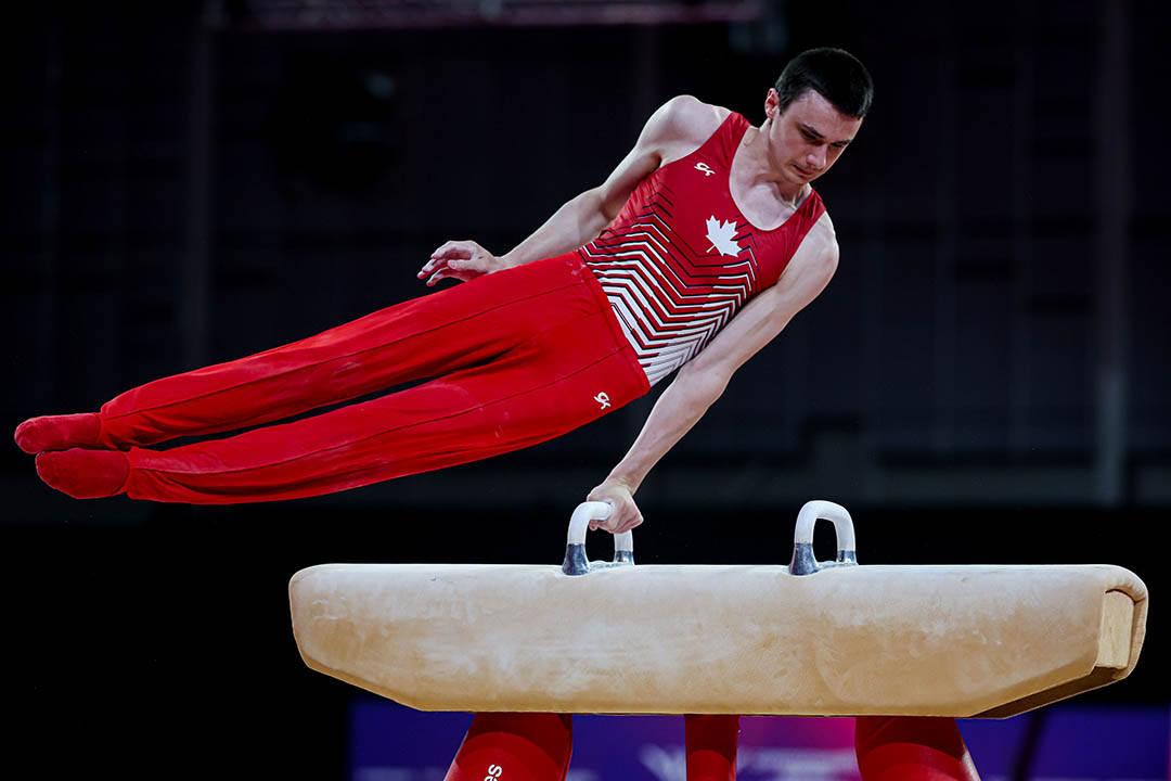 University of Saskatchewan engineering student Jordan Carroll displays the gold medal he won on pommel horse at the Commonwealth Games. (Photo: Antoine Saito/Gymnastics Canada)