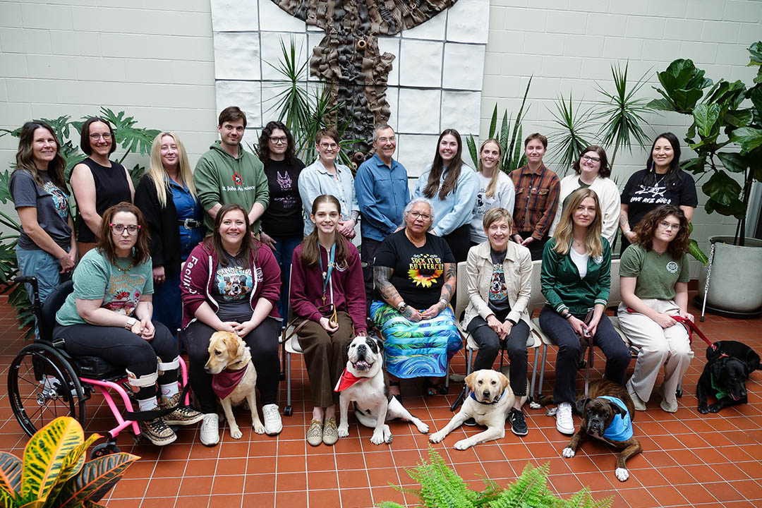 USask’s PAWSitive Connections Lab Co-Directors (L-R) Dr. Darlene Chalmers (PhD), Dr. Colleen Dell (PhD), Dr. Linzi Williamson (PhD). Dogs are (L-R) Delta, Molly, E-Jay, Reina (Photo: Erin Matthews/USask)