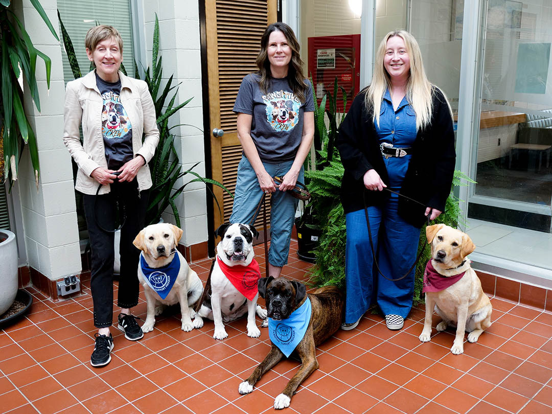 USask’s PAWSitive Connections Lab Co-Directors (L-R) Dr. Darlene Chalmers (PhD), Dr. Colleen Dell (PhD), Dr. Linzi Williamson (PhD). Dogs are (L-R) Delta, Molly, E-Jay, Reina (Photo: Erin Matthews/USask)
