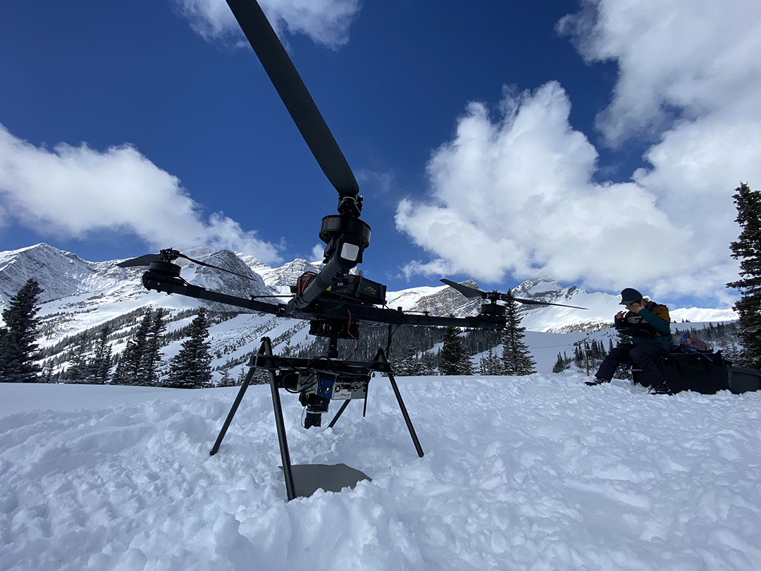 Alex Cebulski, a PhD candidate in USask's Department of Geography and Planning, uses advanced drone technology for snow and water research near the Coldwater Laboratory in Canmore, AB. (Supplied by Alex Cebulski)